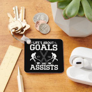 Chaveiro A vida é sobre objetivos e ajuda o taco de hóquei 