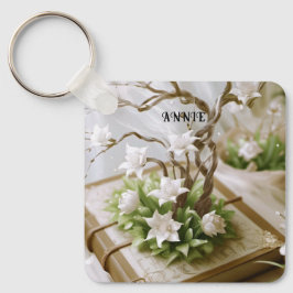 Chaveiro Árvore florescente crescendo a partir de um livro 