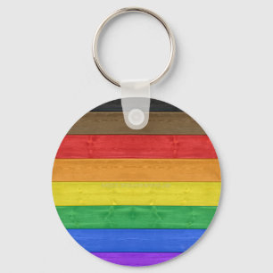 Chaveiro bandeira gay inclusiva de madeira da SlipperyJoe's