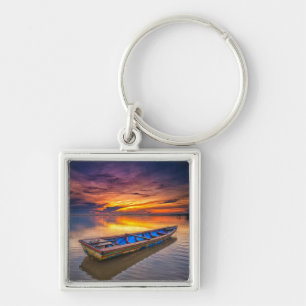 Chaveiro Barco de pesca na praia do nascer do sol Jubakar
