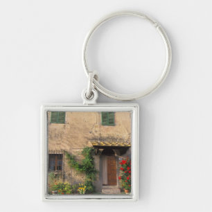 Chaveiro Bela casa antiga com flores em San Gimignano
