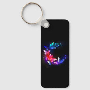 Chaveiro Borboletas Neon Night brilhantes sobre fundo preto