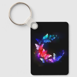 Chaveiro Borboletas Neon Night brilhantes sobre fundo preto