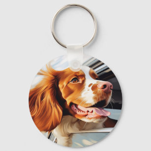 Chaveiro Brittany spaniel na janela do carro