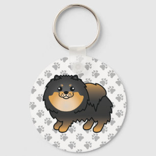 Chaveiro Cão e patas, de cor branca, preto e castanho