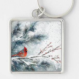 Chaveiro Cardinal Vermelho no Ramo de Pinheiro Nevado