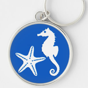 Chaveiro Cavalo-da-costa e estrelas-do-mar - branco em azul