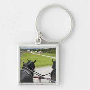 Chaveiro Cavalos de Perchon que puxam o carro contra