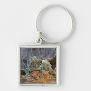 Chaveiro com dois lagartos curiosos