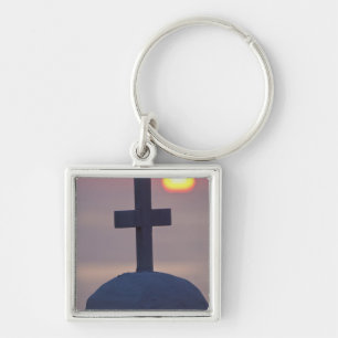 Chaveiro Cruz no topo da igreja ao pôr do sol, Mykonos,
