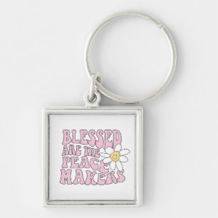 Chaveiro Daisy and Peace Makers Slogan
