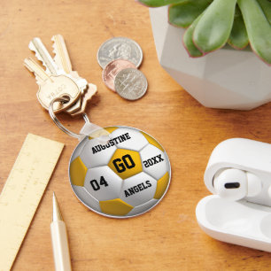 Chaveiro de bola branca e amarela do futebol