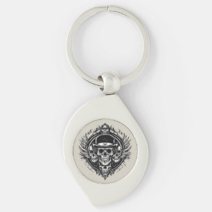 Chaveiro Desenho Intricado de Caveira com Asas e Símbolos