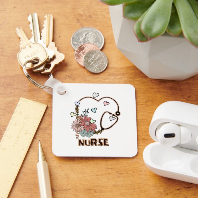 CHAVEIRO ENFERMEIRO DE RETRO DE CORAÇÕES FLORAIS AZUIS (Mesa)