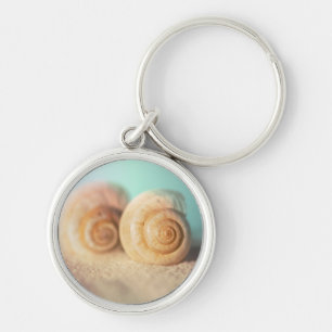 Chaveiro Escudos do nautilus na praia