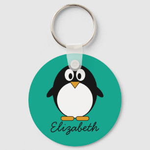 Chaveiro esmeralda bonito e preto do pinguim dos desenhos