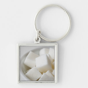 Chaveiro Estúdio disparado de cubos do açúcar na bacia
