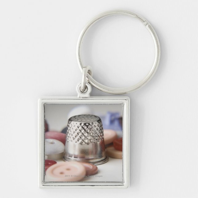 Chaveiro Fim-acima dos botões com um boné do metal (Frente)