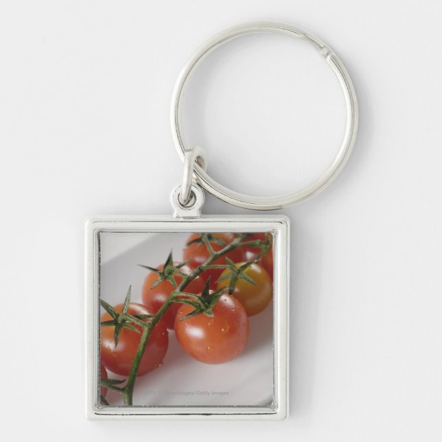 Chaveiro Fim-acima dos tomates em uma bandeja (Frente)