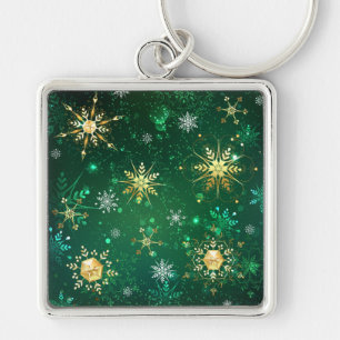 Chaveiro Flocos de neve do Ouro Xmas em fundo verde