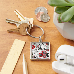 Chaveiro Flores e folhas de rabo em vermelho e preto