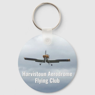 Chaveiro Flying Club Keyring com aeronave leve.