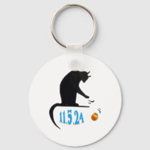 Chaveiro Gato Engraçado Espetando Laranja Na Mesa Da Eleiçã