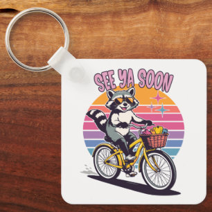 Chaveiro Guaxinim Vintage Andando de Bicicleta Até Logo ao