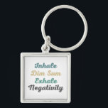 Chaveiro Inhale Dim Sum Exhale Negativity Keychains<br><div class="desc">Take your love for dim sum with you wherever you go with these stylish "Inhale Dim Sum Exhale Negativity" keychains. Featuring a bold and eye-catching design, these keychains serve as a reminder to inhale the goodness of life and exhale negativity. Made from high-quality materials, they are durable and long-lasting, ensuring...</div>