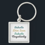 Chaveiro Inhale Dim Sum Exhale Negativity Keychains<br><div class="desc">Take your love for dim sum with you wherever you go with these stylish "Inhale Dim Sum Exhale Negativity" keychains. Featuring a bold and eye-catching design, these keychains serve as a reminder to inhale the goodness of life and exhale negativity. Made from high-quality materials, they are durable and long-lasting, ensuring...</div>