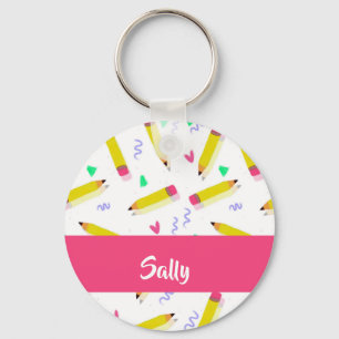 Chaveiro lápis amarelas e escamas brancas