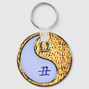 Chaveiro Libra e Ox de Fogo