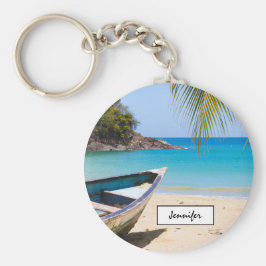 Chaveiro Linda praia tropical com um barco a remo