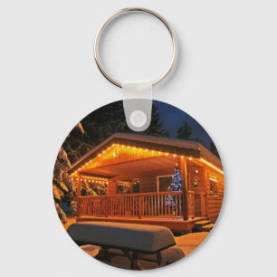 Chaveiro Luzes de Natal bonitas em Log Cabine na neve