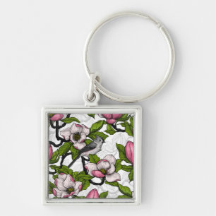 Chaveiro Magnólia florescente e pássaro-do-titrato