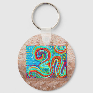 Chaveiro Mantra de OM na arte dourada da base da jóia