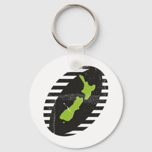 Chaveiro Mapa de Nova Zelândia na bola de rugby suja