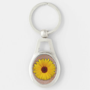 Chaveiro Marigold de girassol sobre Conselhos de madeira ru
