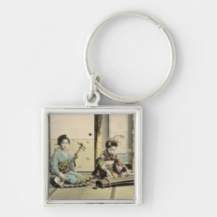 Chaveiro Meninas japonesas que jogam a flauta, o "koto" e