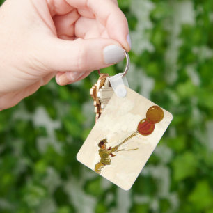 Chaveiro Menino Antigo com Balões Vermelhos em uma Festa de