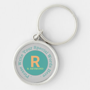 Chaveiro monograma e texto personalizado sobre um belo teal