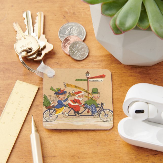 Chaveiro Natais vintages, Papai Noel andando de bicicleta (Mesa)