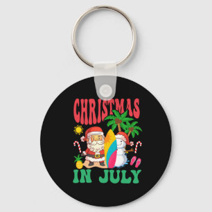 Chaveiro Natal de Papai Noel surfando na praia havaiana em