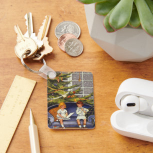 Chaveiro Natal vintage, crianças que sentam-se em um sofá