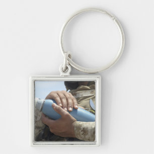 Chaveiro Opinião do Fim-acima um soldado que embala uma