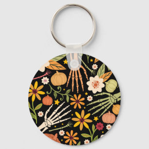 Chaveiro Ossos de Halloween, padrão floral uniforme.