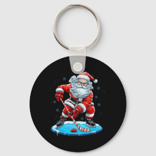 Chaveiro Papai Noel engraçado do Natal jogando hóquei no ge