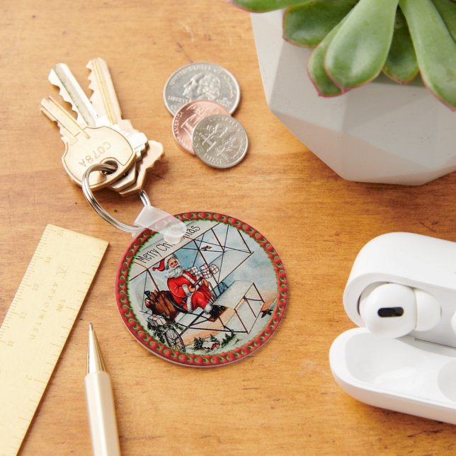 Chaveiro Papais noeis de Natal voando em um avião antigo (Mesa)