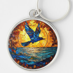 Chaveiro Passarinho sobre o Oceano do Pôr do Sol