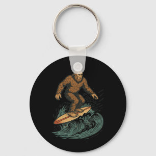 Chaveiro Pé Grande Surfando Arte Retro de Praia de Criptozo